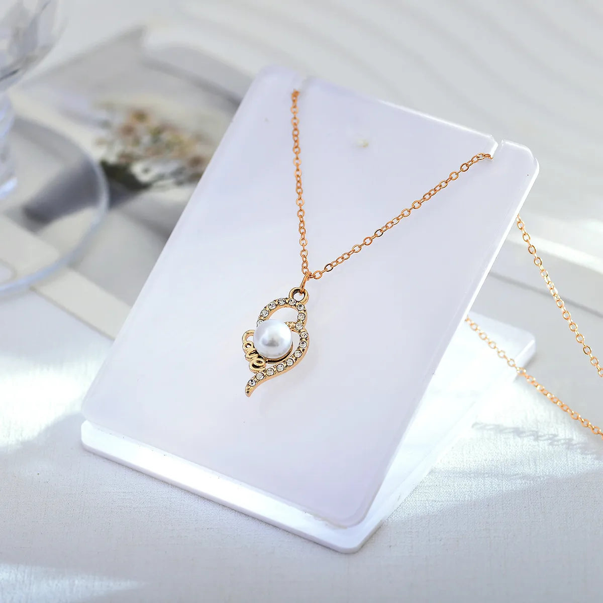 Necklaces With Firm Locks-Elegant Lady Simple Style Geometric Alloy Titanium Steel Plating Inlay Artificial Pearls Rhinestones Women's Pendant Necklace