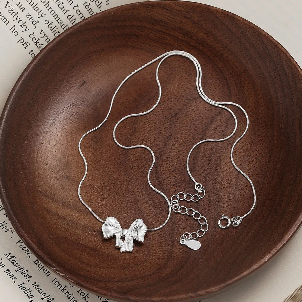 Necklaces For Bare Glow-Sterling Silver Hollow Out Bow Knot Pendant Necklace